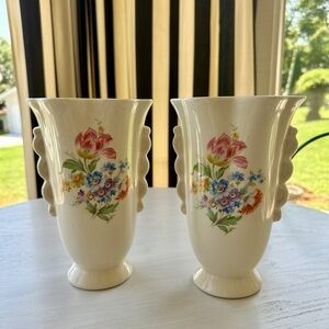 1950’S SET/2 , FLORAL VASES. SOFT CREAM COLOR WITH ONE SIDED FLORAL DESIGN.